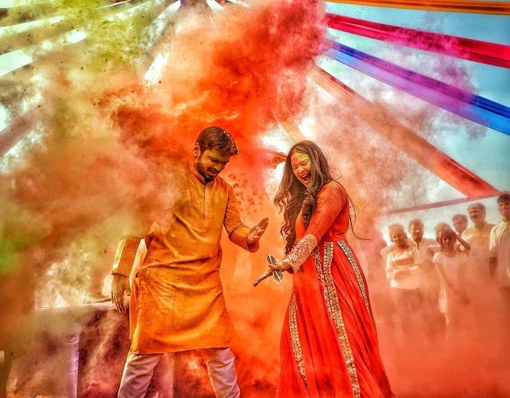 girl playing with squirt gun on Holi festival 